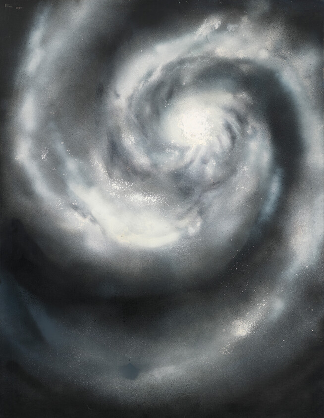 A bright spiral galaxy with a glowing central core and swirling cloudy arms.