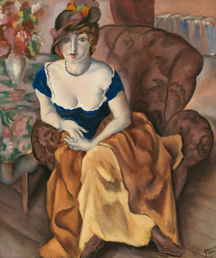 A seated woman in a blue bodice and yellow skirt looks directly at the viewer.