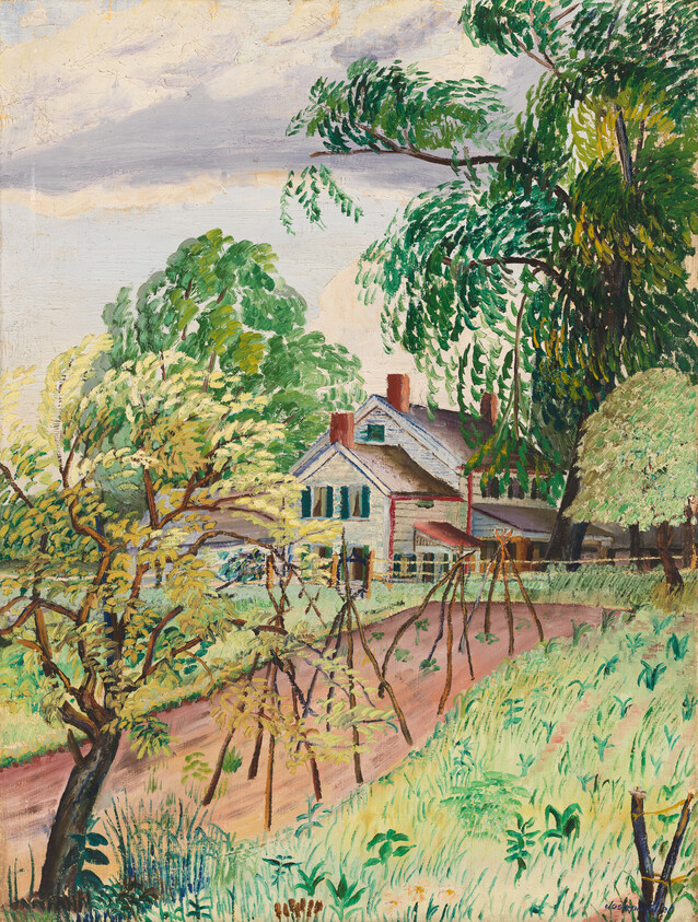 A white farmhouse surrounded by tall green trees and a dirt path with garden stakes.