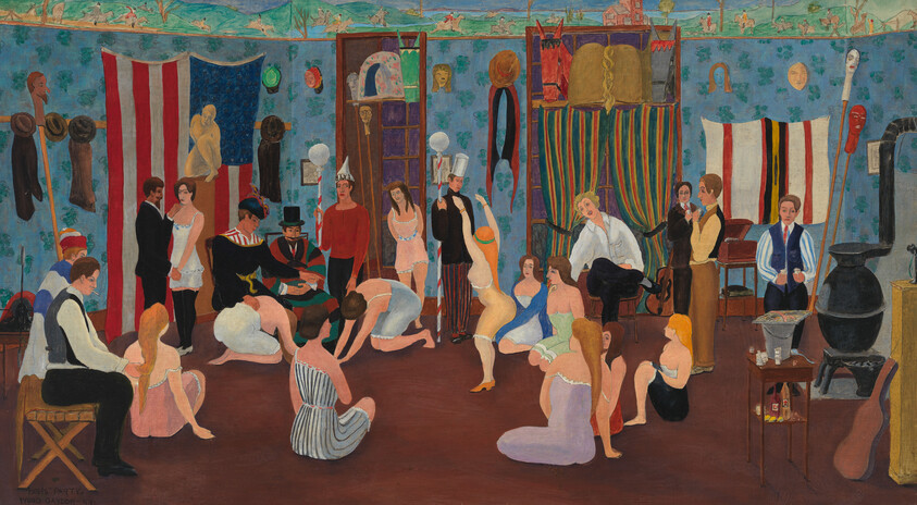 People in a crowded rehearsal room, performers preparing and socializing in colorful costumes and props.