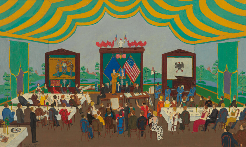 A speaker addresses a seated audience in a decorated banquet hall with American and state flags.