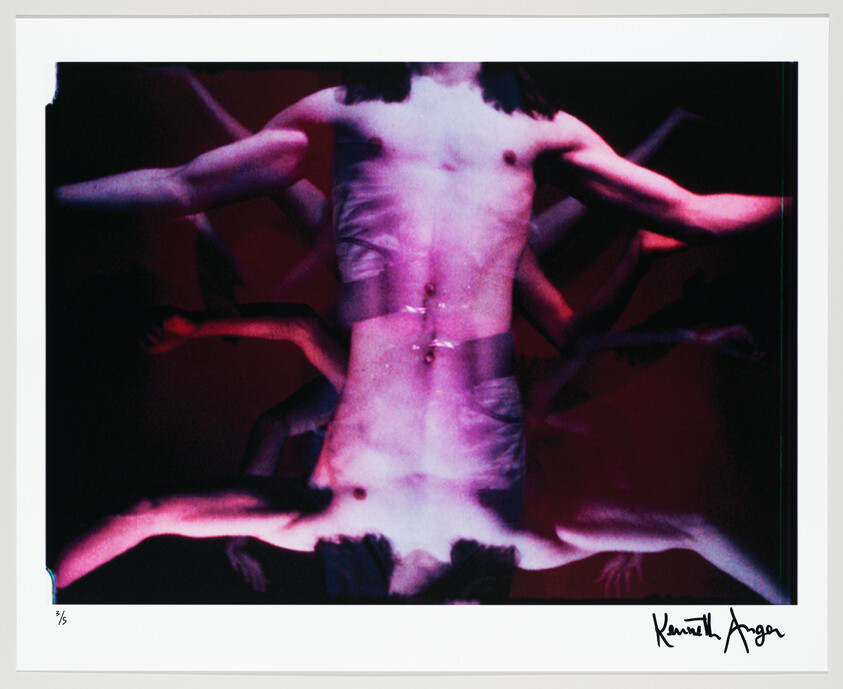 A shirtless torso with multiple blurred, outstretched arms in purple and red lighting.