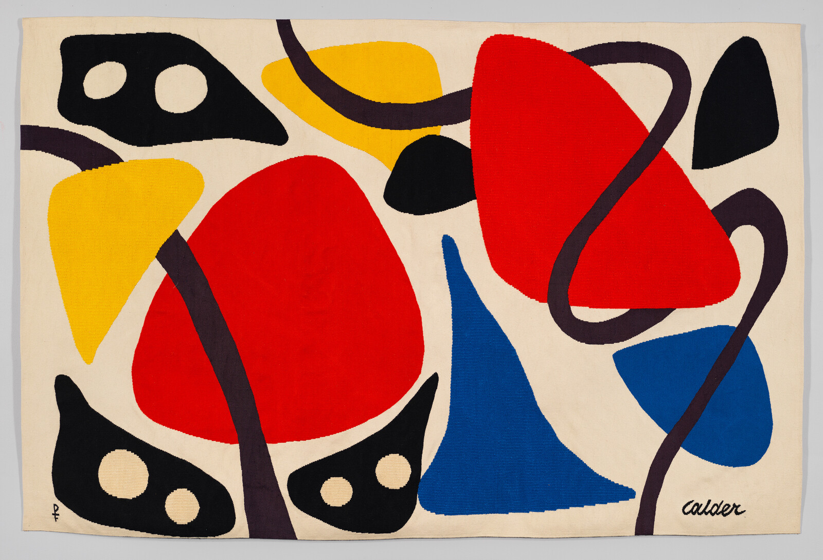 Bright abstract tapestry with large red, blue, yellow, and black organic shapes and curving dark lines.