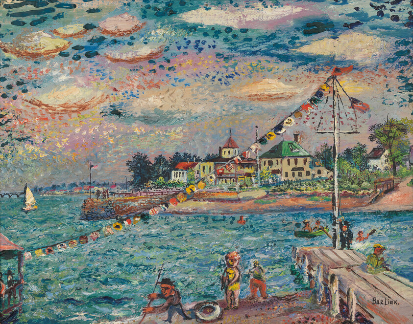 People enjoy a sunny seaside pier with boats, swimmers, and colorful signal flags strung across.