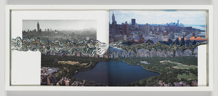 A two-page aerial view of New York City and Central Park with a wavy distorted band across the skyline.