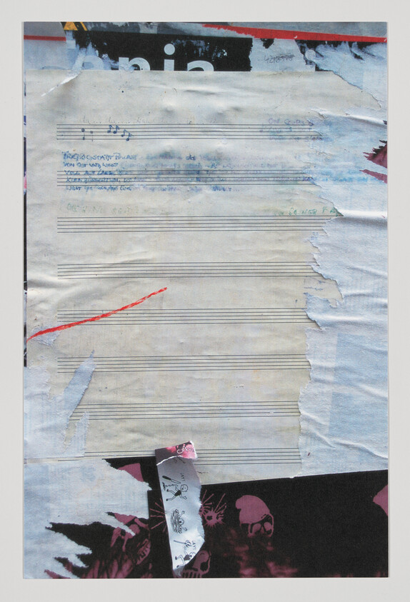 Torn sheet music poster with blank staff lines, faint handwritten notes, and a red streak.