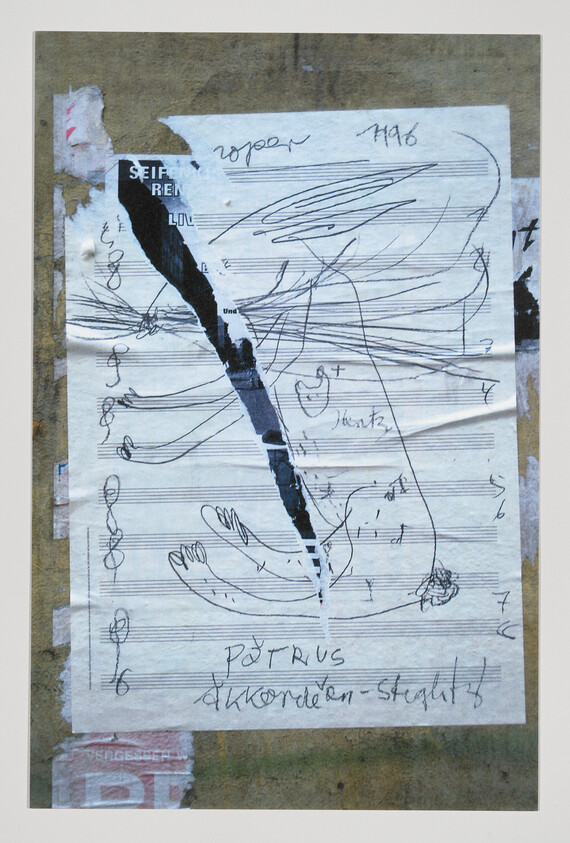 Torn sheet of handwritten musical staff paper with pen doodles and scribbled notes titled Patrus.
