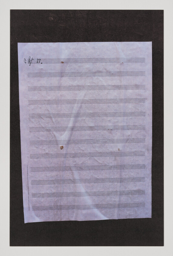 Blank sheet music paper with a treble clef and 4/4 time signature in the top-left corner.