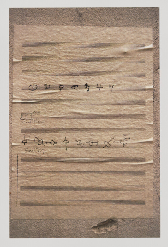 Aged music manuscript paper with handwritten musical symbols and the word "sailing."