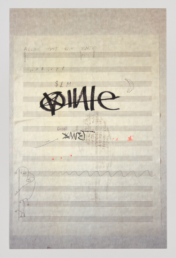 A sheet of music paper with a large black stylized "SMILE" graffiti and small doodles.