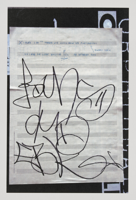 Sheet music page covered in large black graffiti-style scribbles and looping marks.