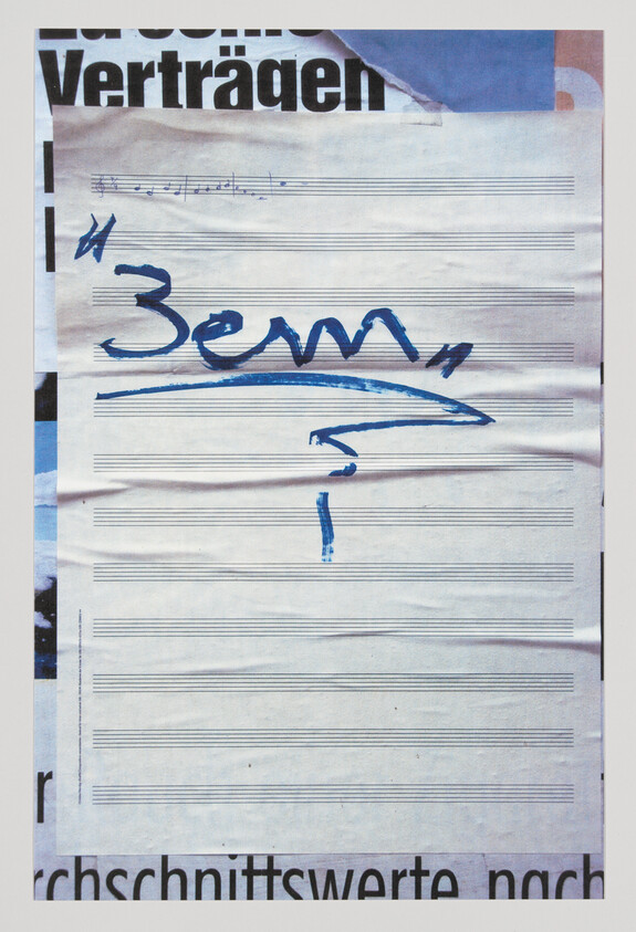 A blank sheet of musical staff paper with bold blue marker scribbles, an arrow, and a question mark.