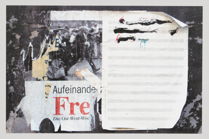 Torn street poster collage with blank sheet music paper and ripped printed text fragments.