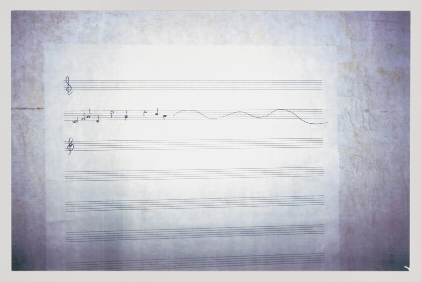 Blank sheet music with two treble clefs and a short melody of notes and a wavy line.