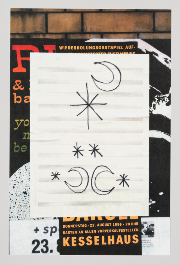 A photograph of a piece of paper with handwritten asterisks and crescent moon symbols on lined music staff paper, partially covering a collage of posters with various texts and images, including dates and times, suggesting an event or series of events.