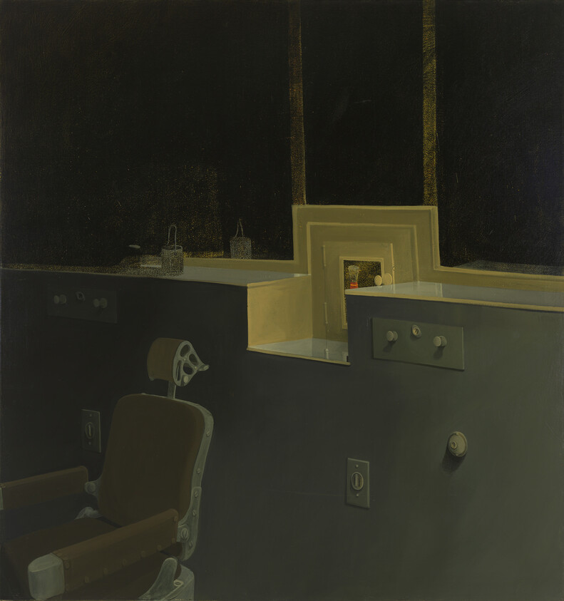 An empty vintage dental chair faces a dark counter with a small illuminated recessed shelf.