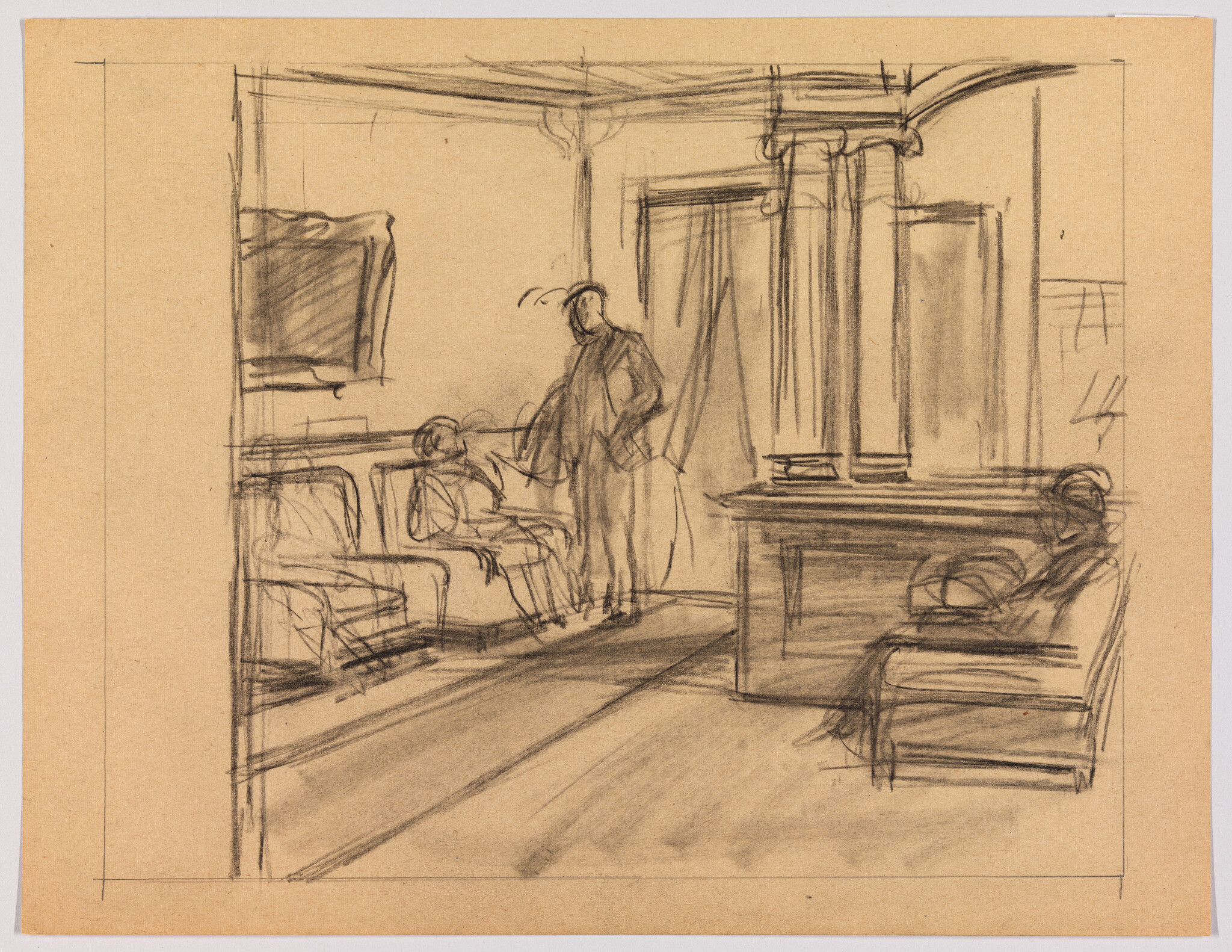 A person stands talking to a seated patient in a sparsely furnished waiting room.