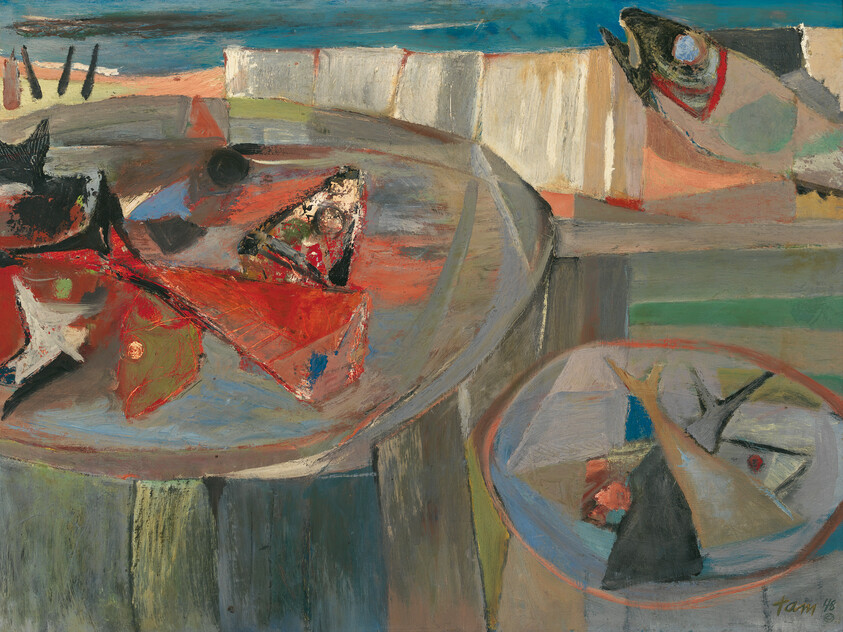 Several fish and red cloth pieces lying in large round basins by the water.