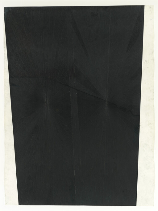 A large black rectangular sheet with subtle creases and white borders.