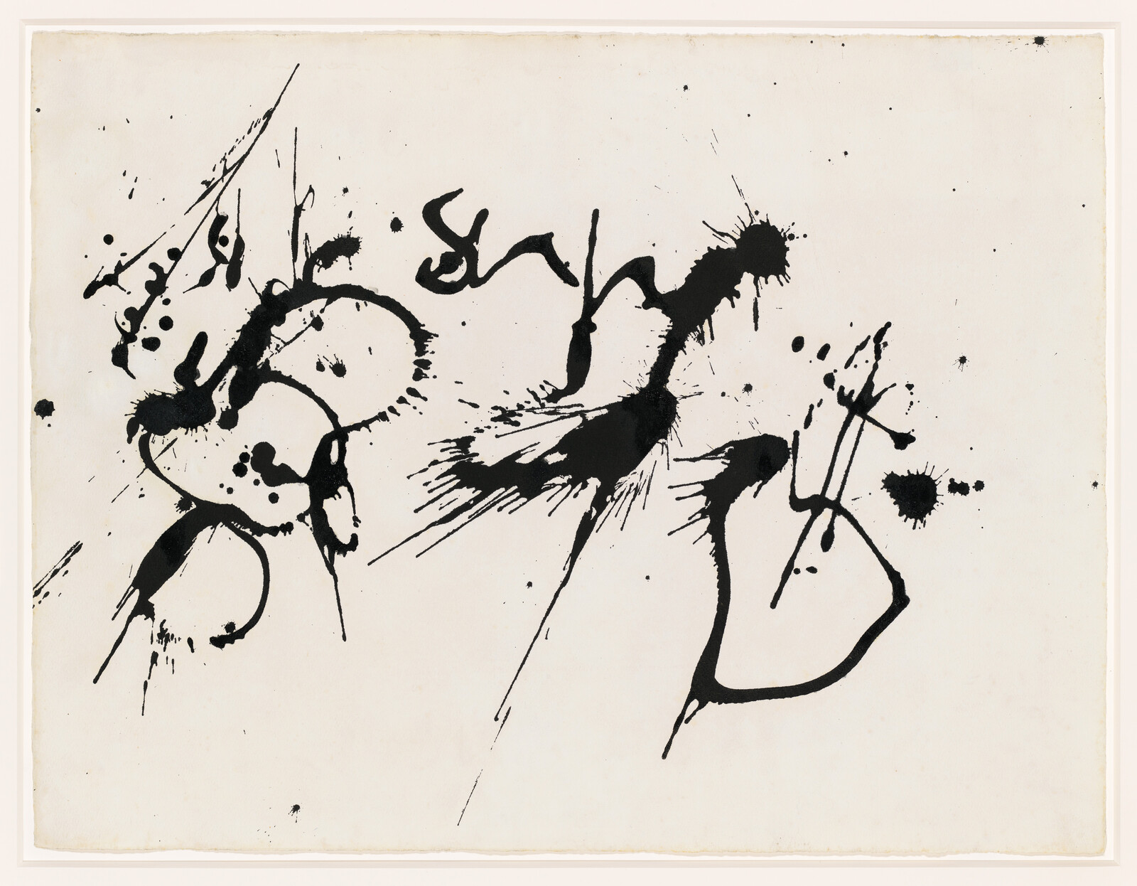 Black ink splatters and sweeping brush strokes form abstract shapes across a white sheet.