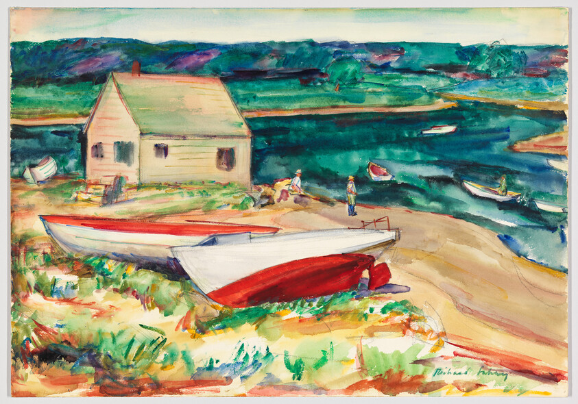Two beached rowboats sit on a sandy shore near a small cottage while people walk by the water.