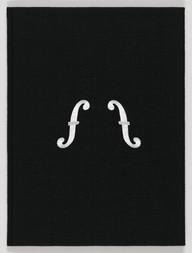 Black book cover with two white stylized violin f-holes arranged side by side.