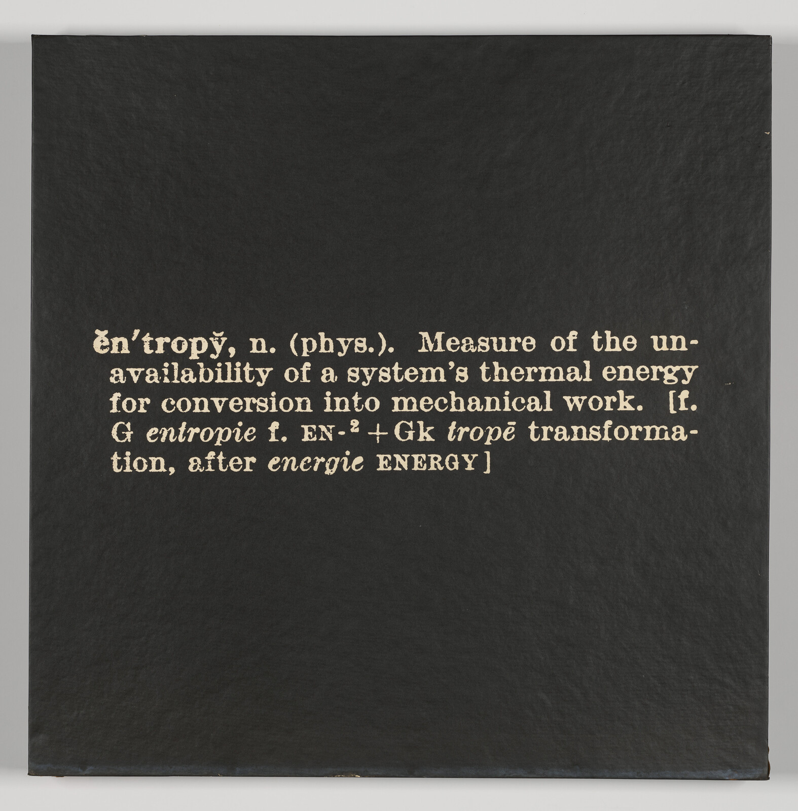 Black board with printed definition of 'entropy' describing unavailable thermal energy for mechanical work.