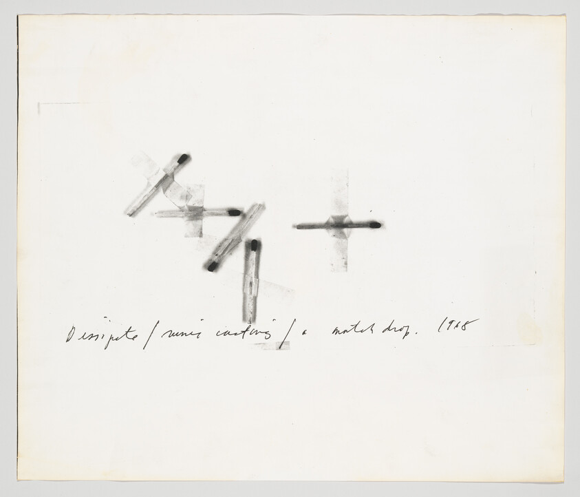 Three burned matchsticks arranged in cross shapes with handwritten notes below.