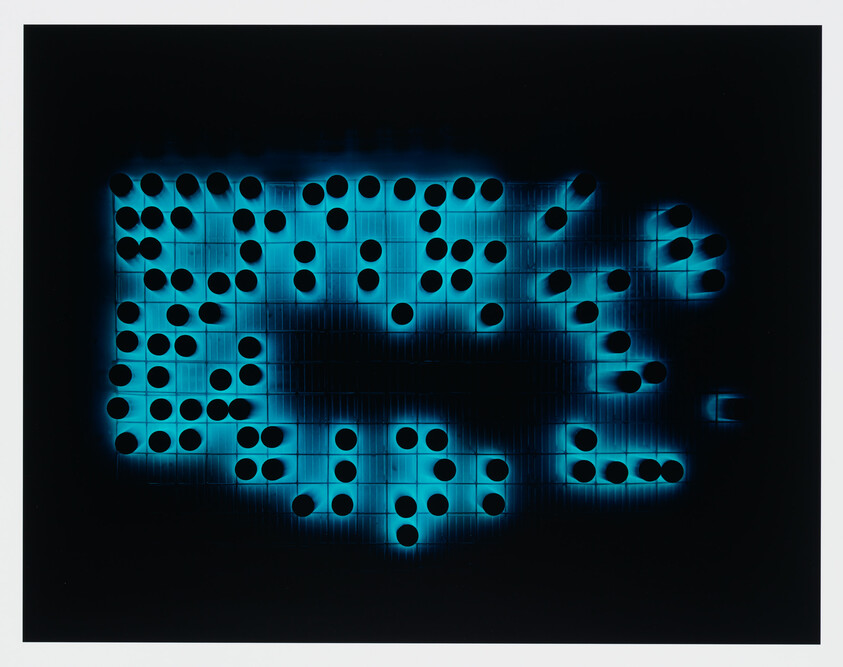 Glowing blue grid with black circular holes arranged in irregular patterns on a dark background.