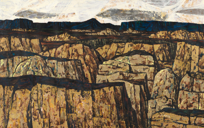 Rugged canyon with steep, layered sandstone cliffs and distant flat-topped mesas under a pale sky.