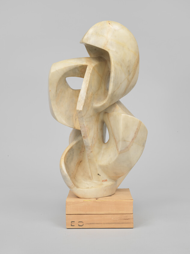 Abstract white marble sculpture with flowing curved forms mounted on a small wooden base.
