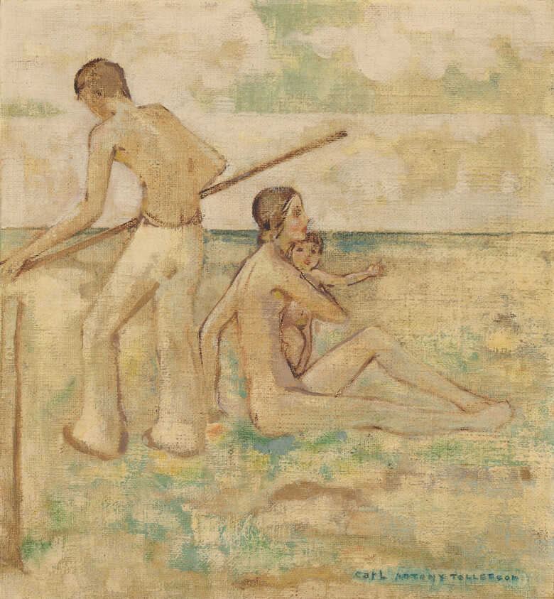A seated mother holds a child on the sandy shore while a man stands with a pole.