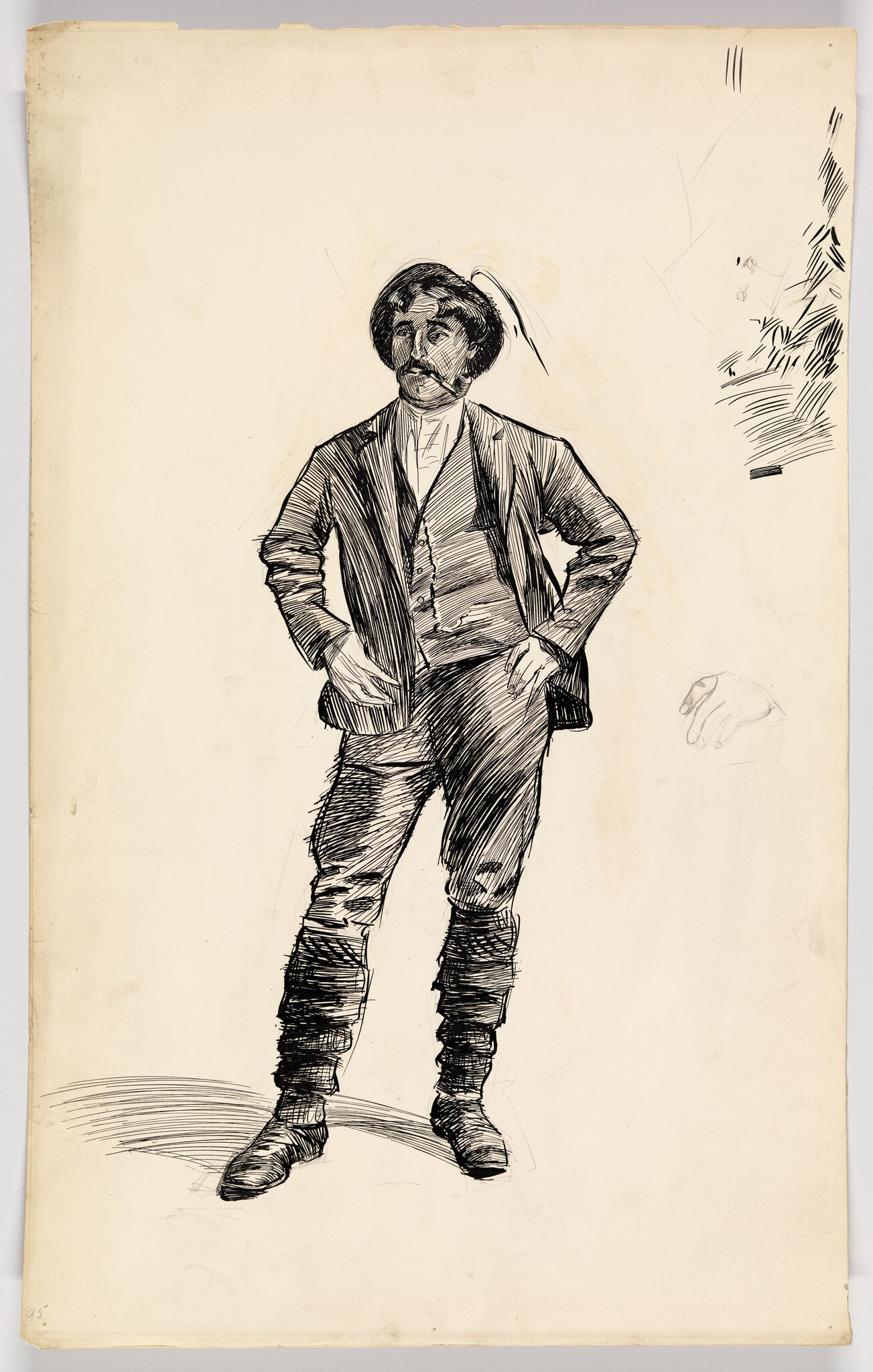 A standing man in a hat and boots poses with his hands on his hips.
