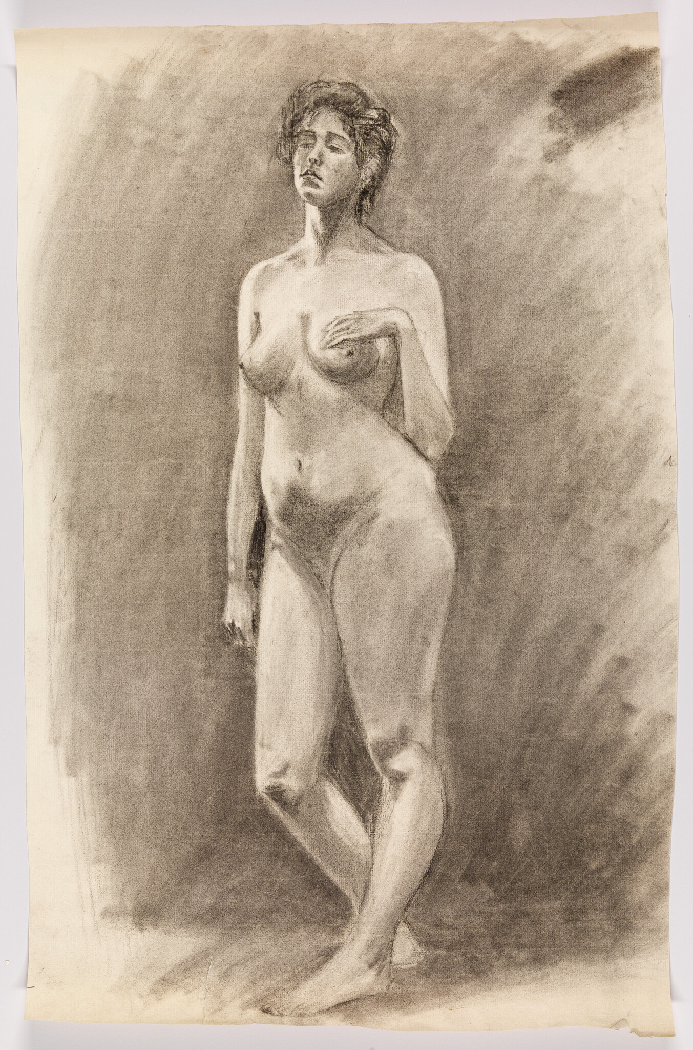 Standing female nude drawn in charcoal with one arm raised and eyes closed.