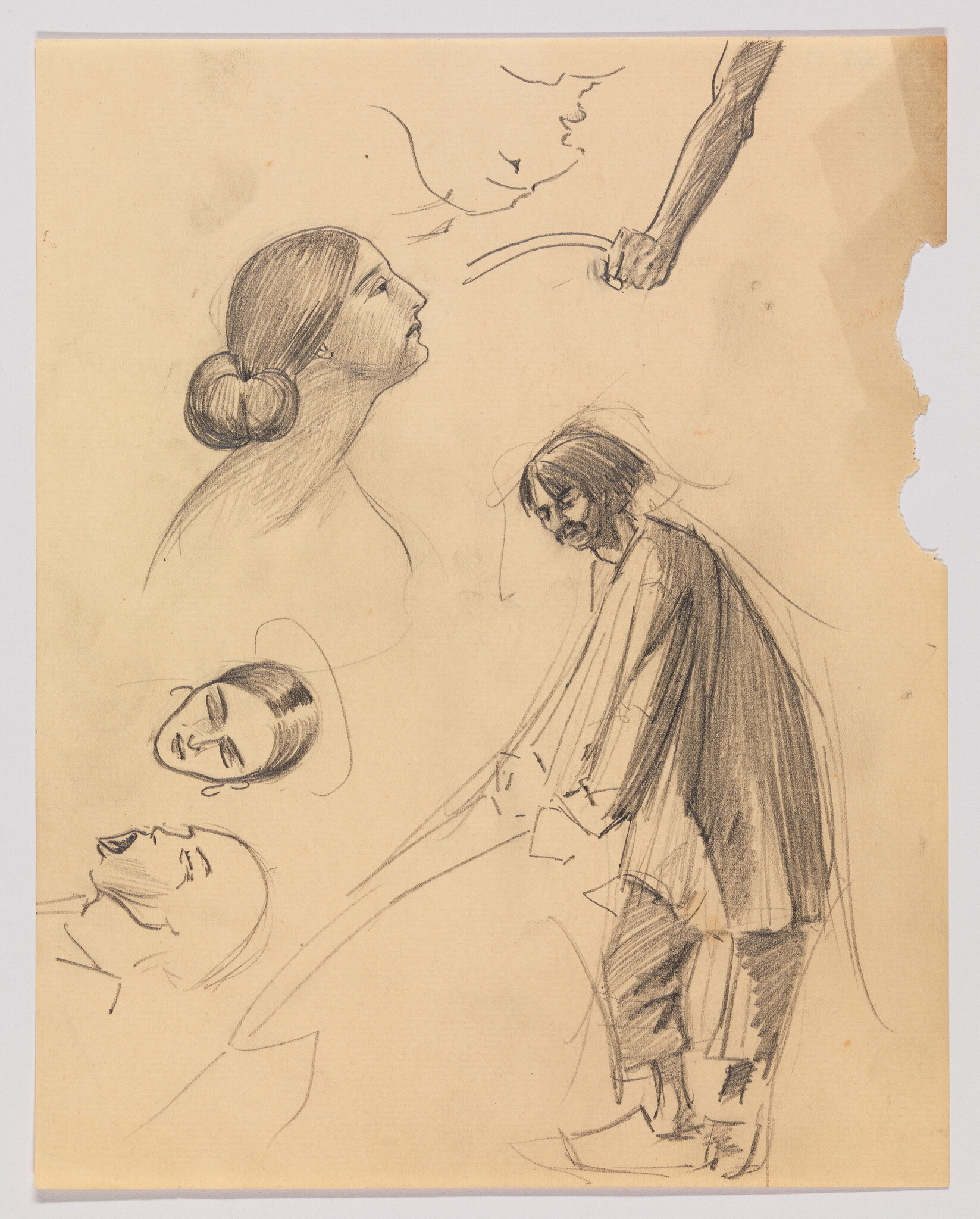 Multiple pencil sketches showing a standing bearded man leaning forward and several woman's head studies.