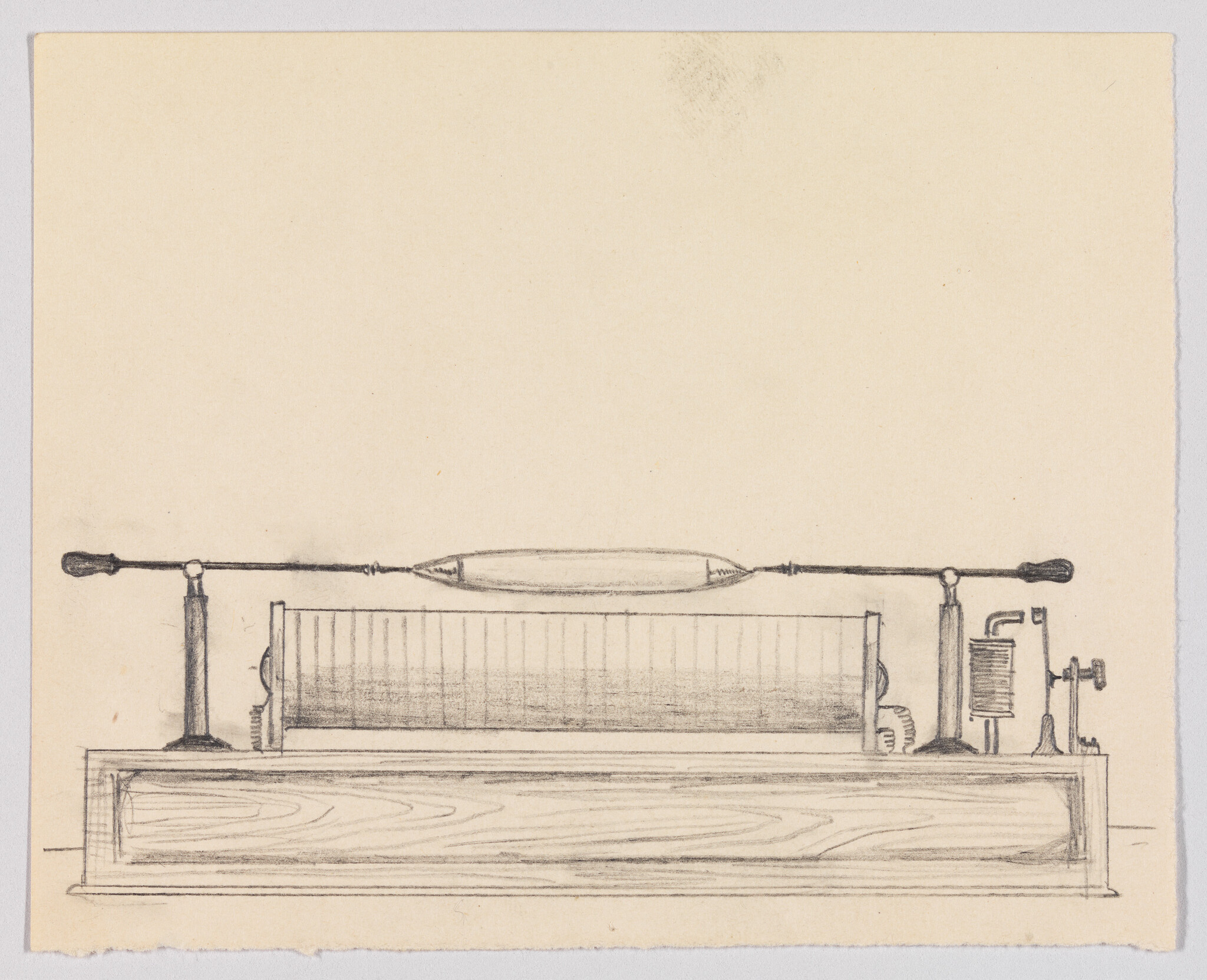 A pencil sketch of a horizontal electromagnetic coil apparatus mounted on a wooden base.