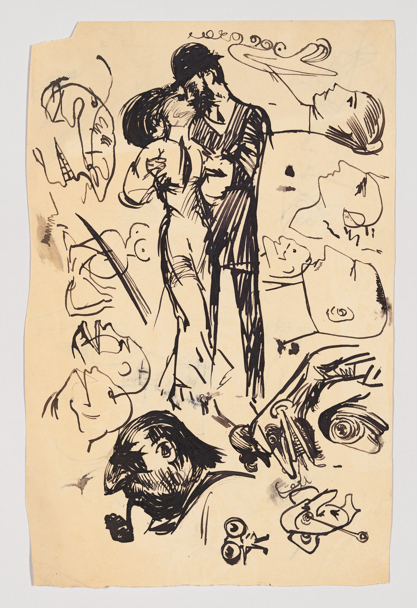 A man and woman embrace and kiss in the center of a page filled with doodled faces.