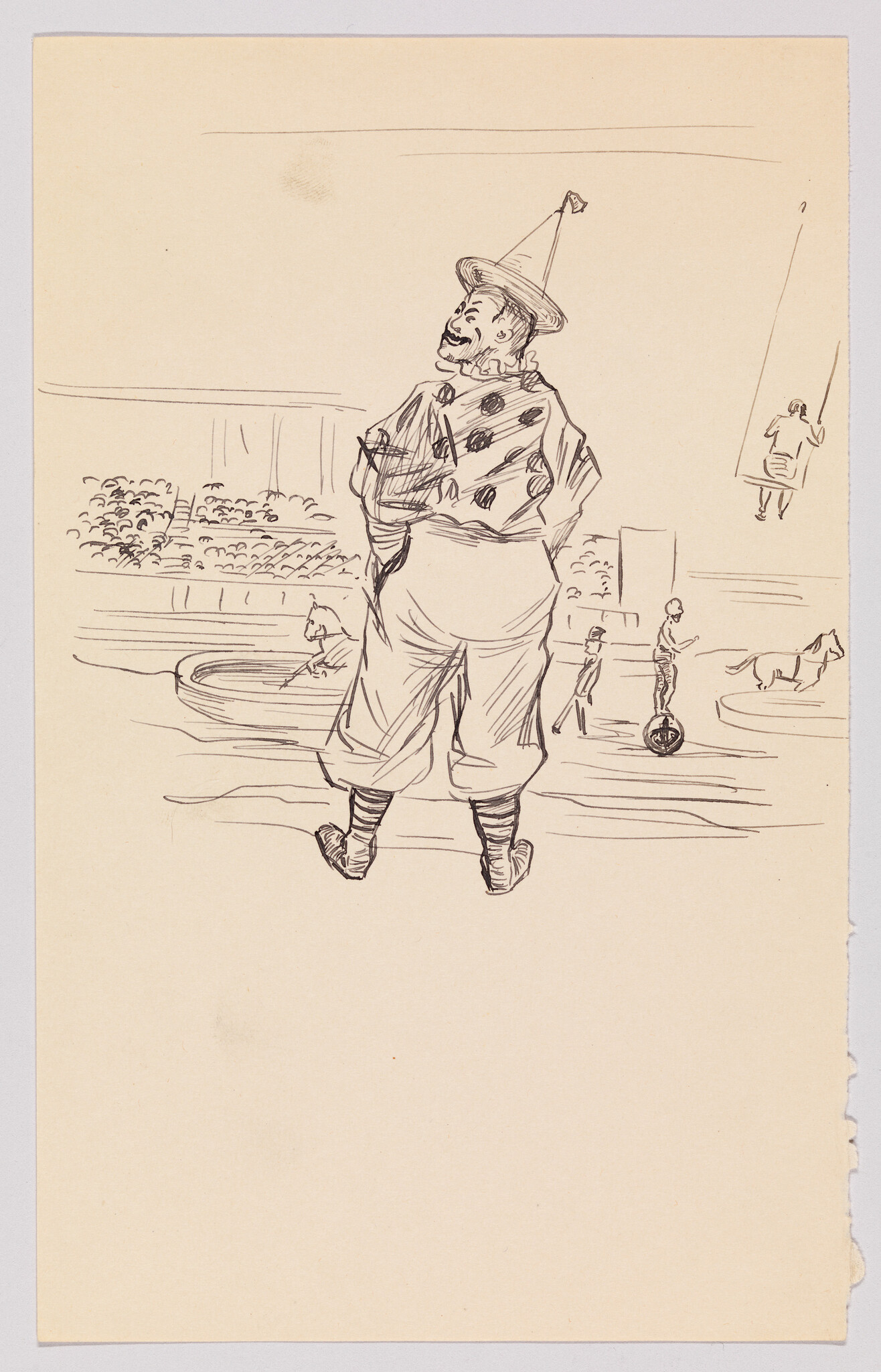 A clown in a polka-dot costume and cone hat stands with hands behind his back watching the circus ring.