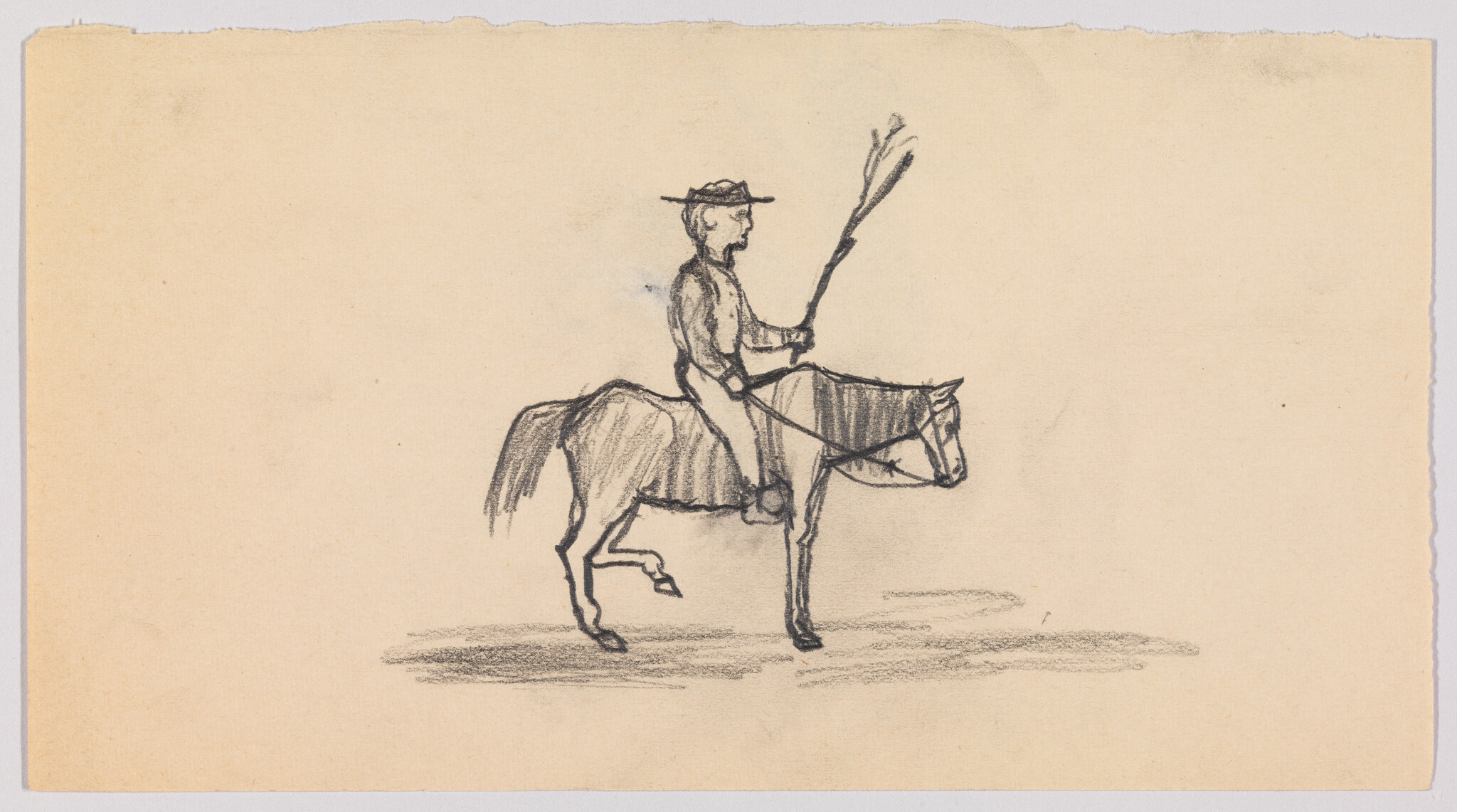 A man in a hat rides a horse while holding a long stick.
