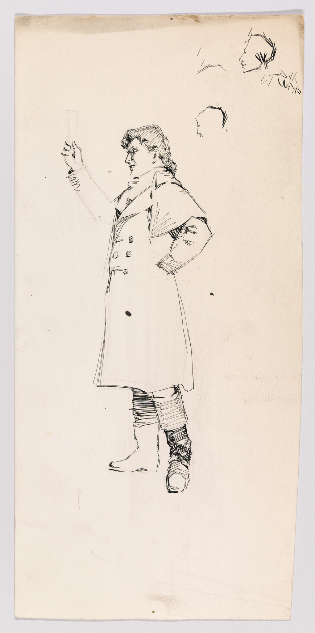 A standing man in a long coat raises a glass while looking to the left.