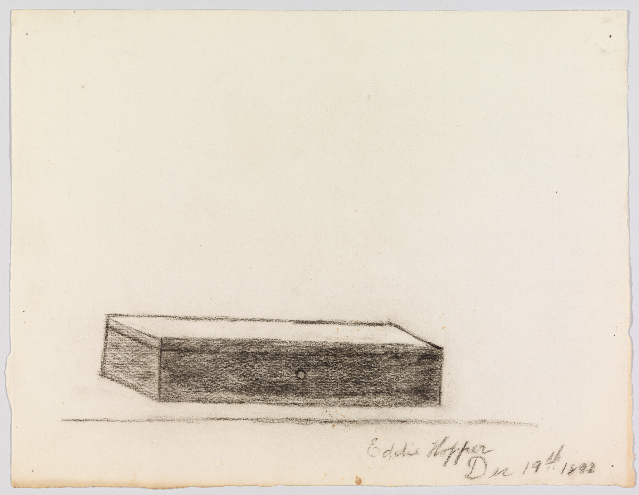 A shaded rectangular wooden box sits on a flat surface in a simple pencil sketch.