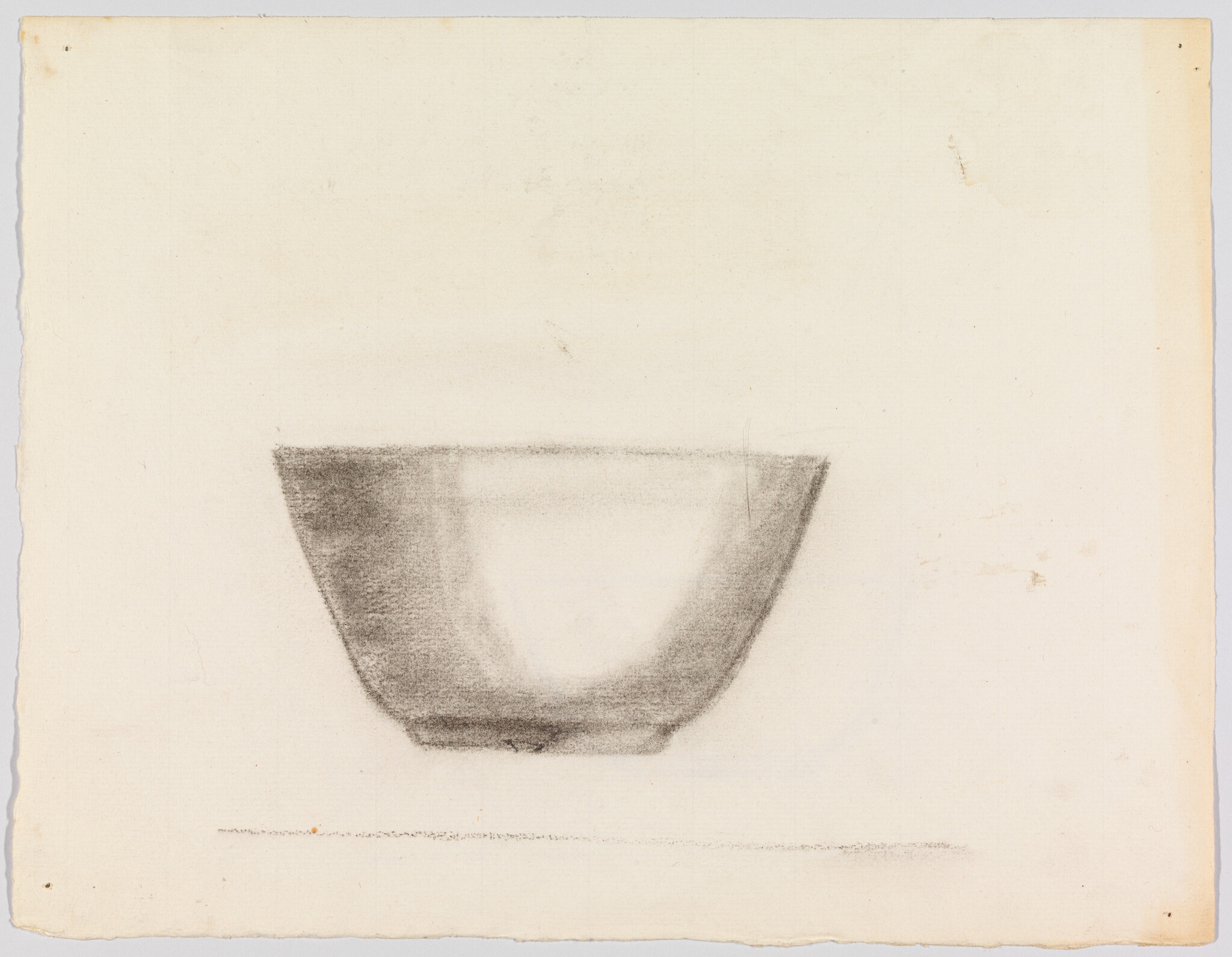 A charcoal sketch of a shallow bowl resting on a flat surface with soft shading.