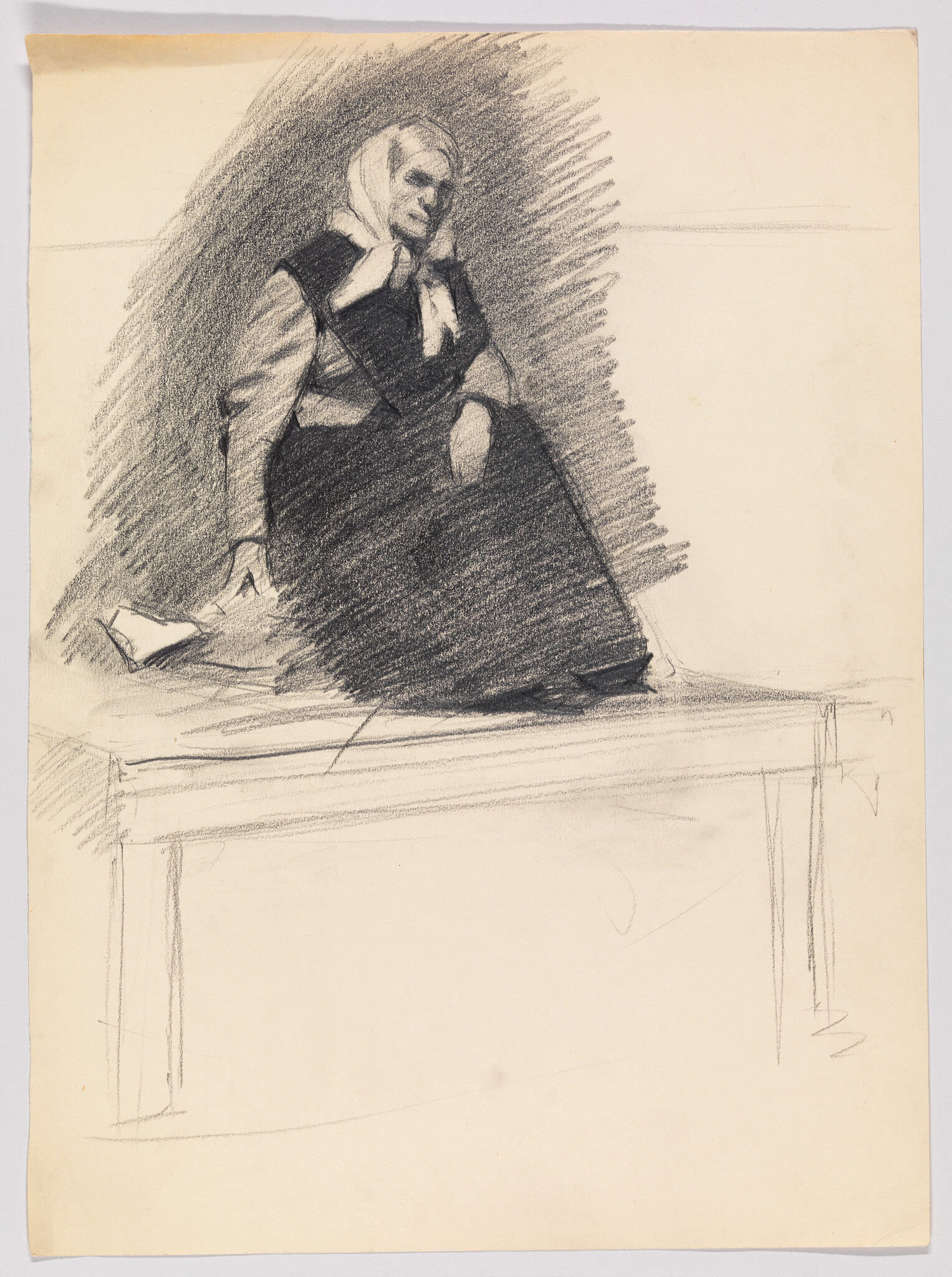 An elderly woman wearing a headscarf sits on a bench with her hand on her cheek.