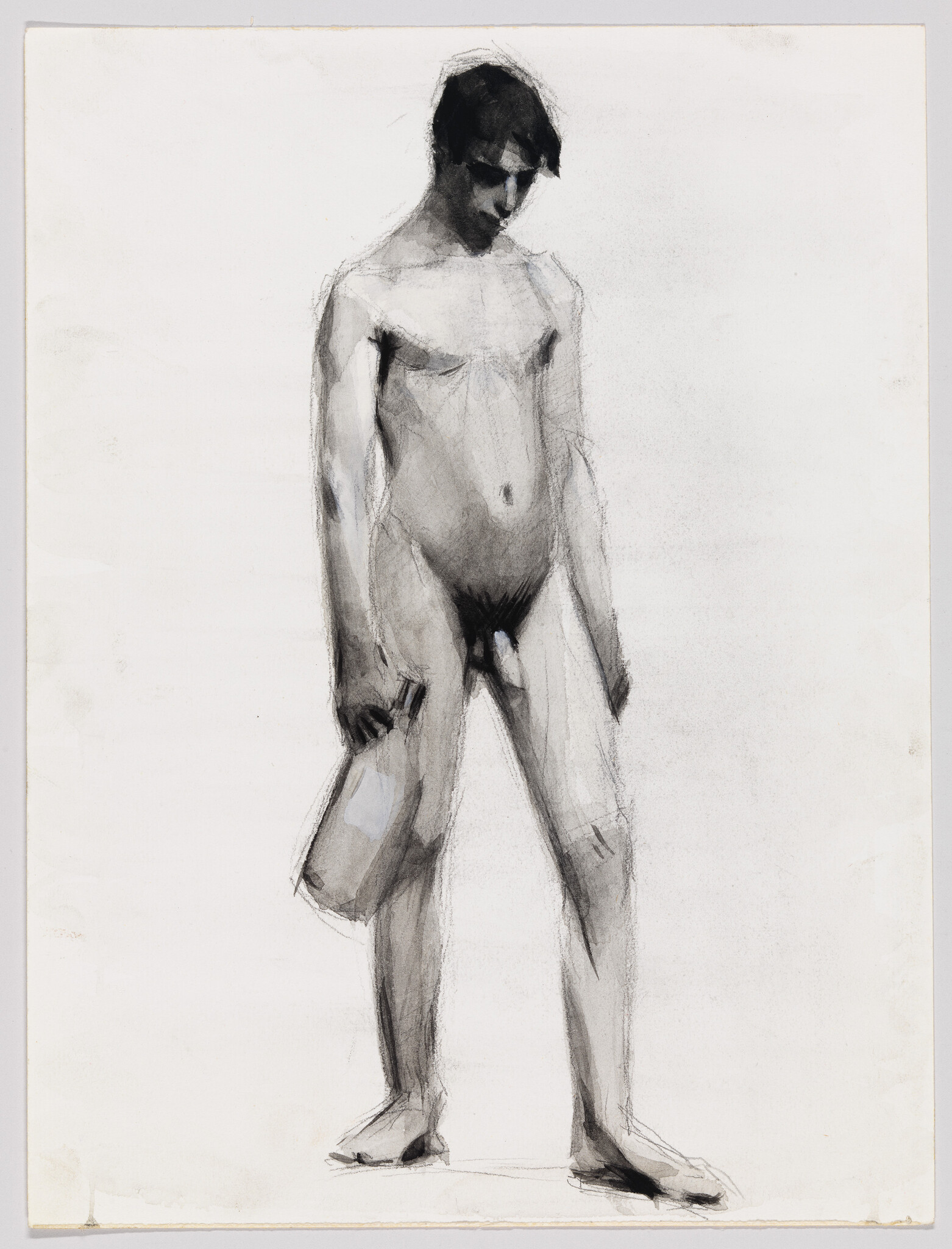 Nude young man standing with head bowed, holding a small bag in his left hand.