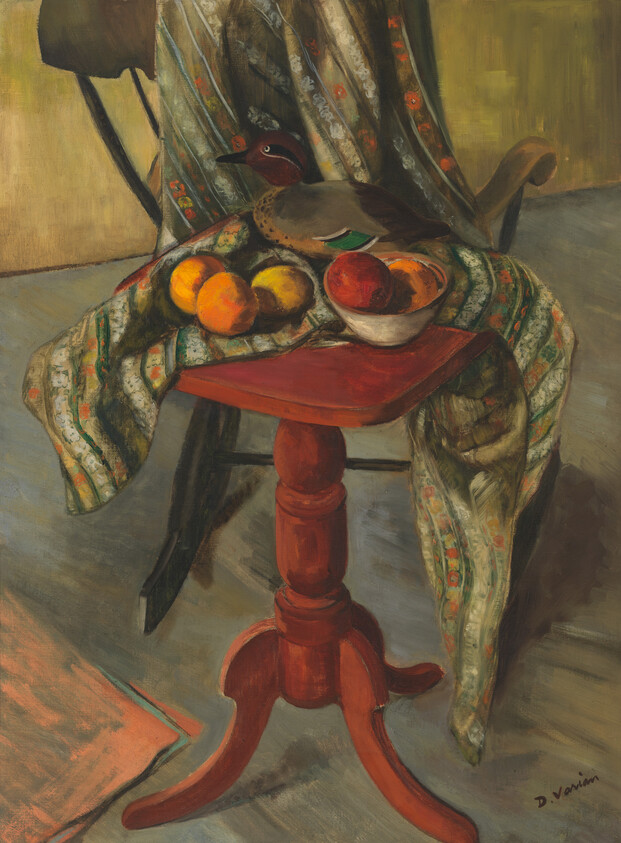 A red pedestal table holds a bowl of fruit and a patterned cloth beneath a duck on a chair.