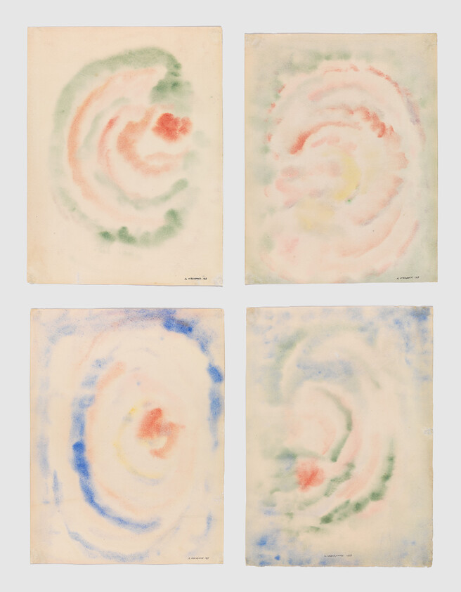 Four abstract watercolor papers show soft pastel spiral shapes arranged in a two-by-two grid.