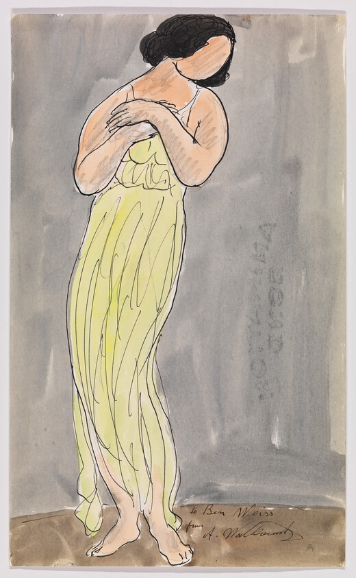 Woman in a flowing yellow dress stands barefoot with arms crossed over her chest.