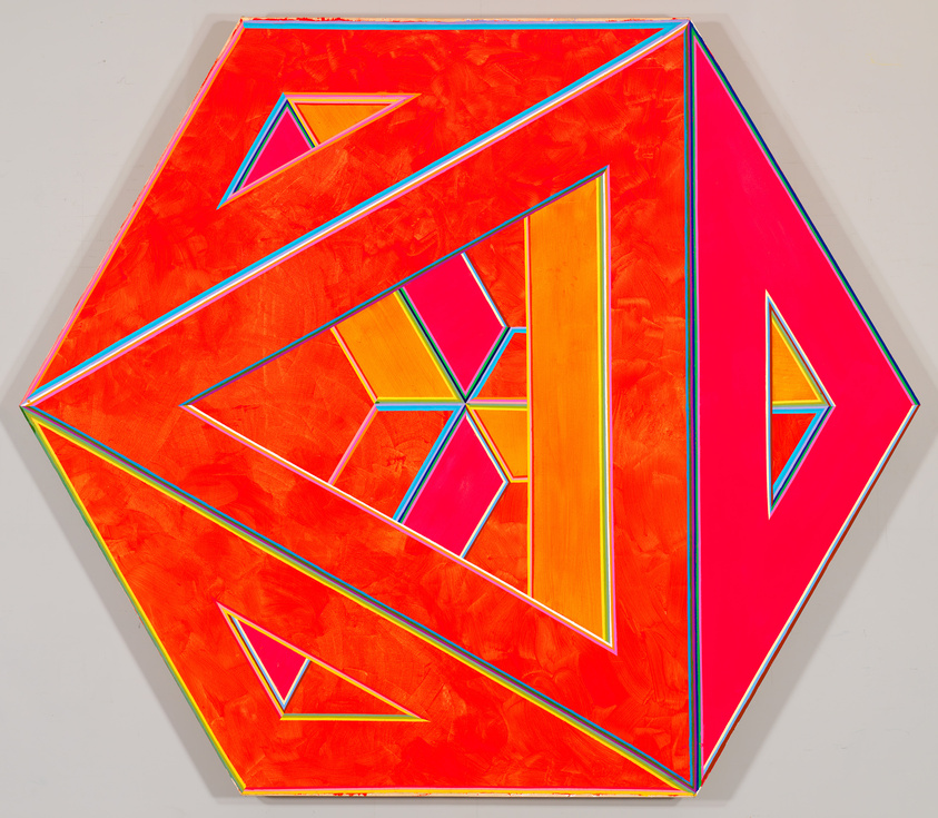 A three-dimensional hexagon in neon orange-reds, red-pinks, and orange-yellows and covered in triangular holes