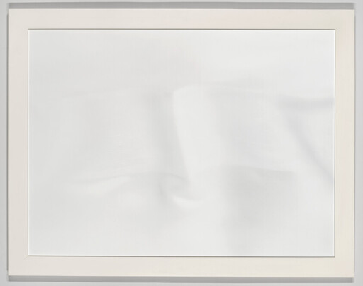 A framed white canvas with faint creases and soft shadows on the surface.