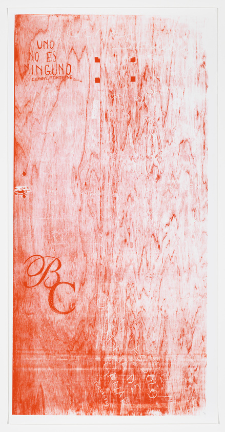 A textured red and white artwork with various markings and text, including the phrase "UNO NO ES NINGUNO" and other illegible writings, possibly signatures, at the bottom. The piece has a distressed or weathered appearance with streaks and scratches throughout.